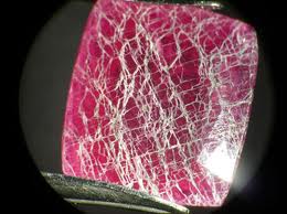 Cracks that can appear in Fracture  filled ruby upon heating or exposure to chemicals Image courtesy ajsgem